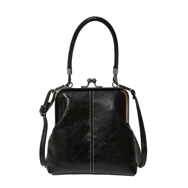 Alicia — Vintage Muschel-Umhängetasche | 50% RABATT